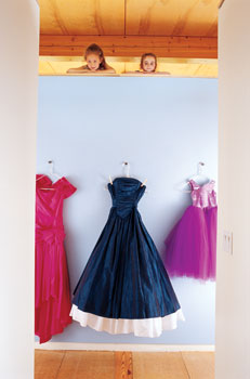 Elegant dresses from a local secondhand store decorate the entrance to the children’s room.